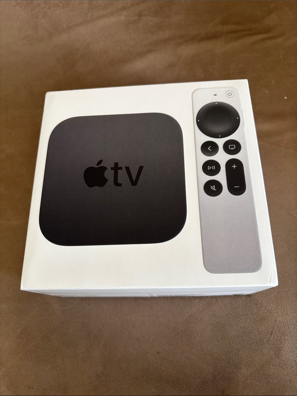 Apple TV with Silver Remote and Black Streaming Box